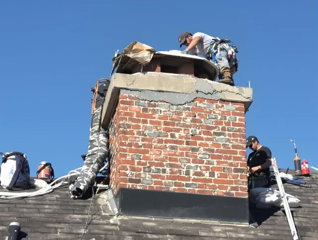 Bristol Chimney Sweep installing a custom chimney crown in Bristol, CT