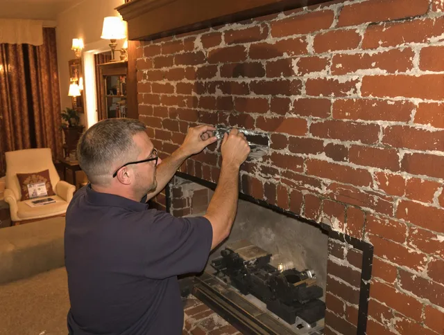 Bristol Chimney Sweep expert fixing a fireplace in Bristol, CT